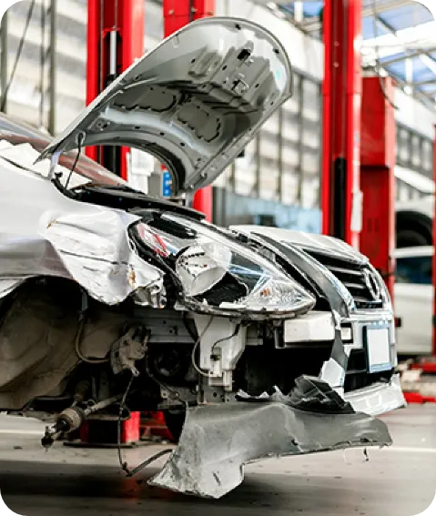 A Mechanic Repairs A Car In A Well-Equipped Garage Filled With Tools.